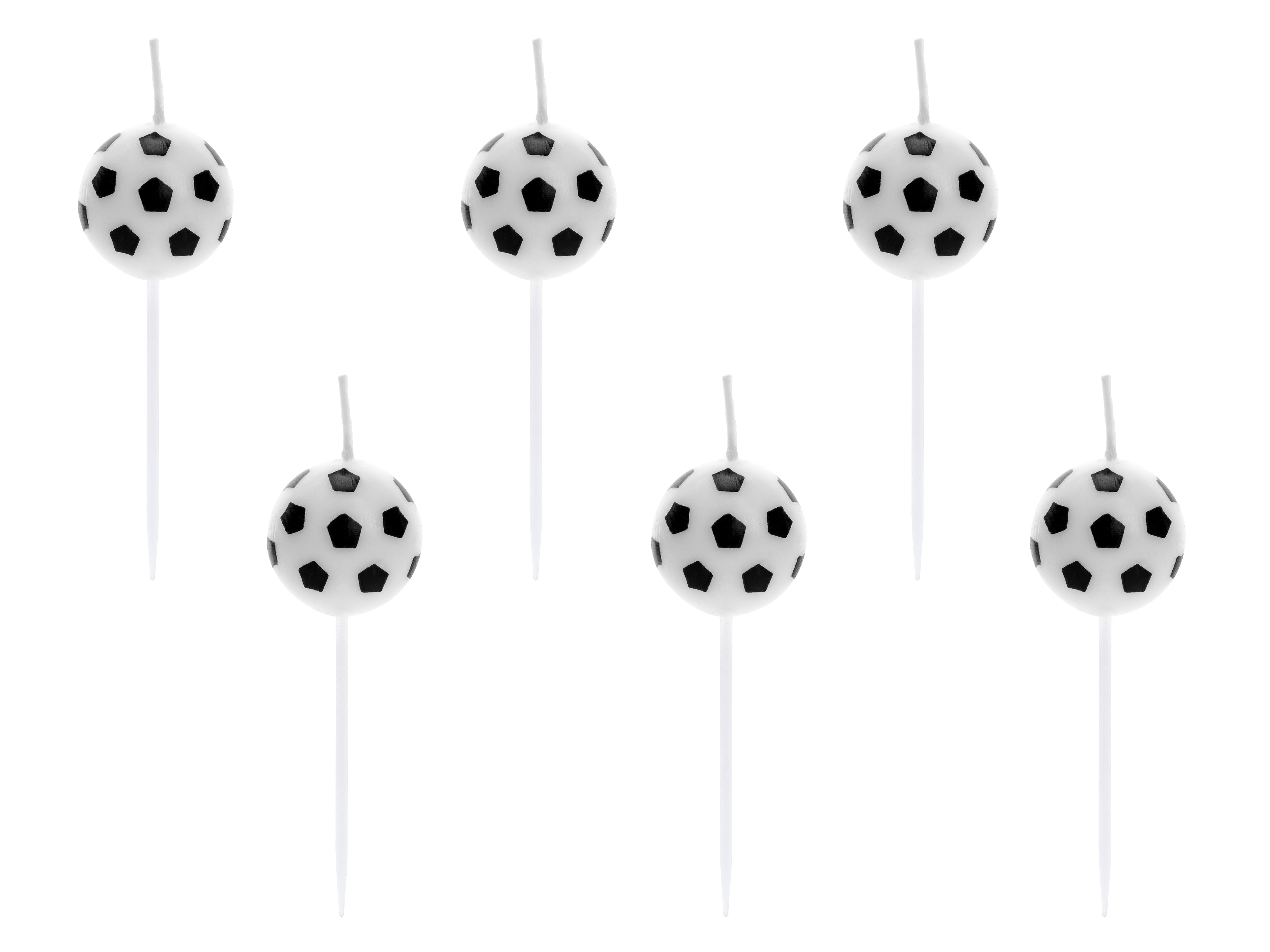 Soccer ball-shaped candles on sticks against a white background