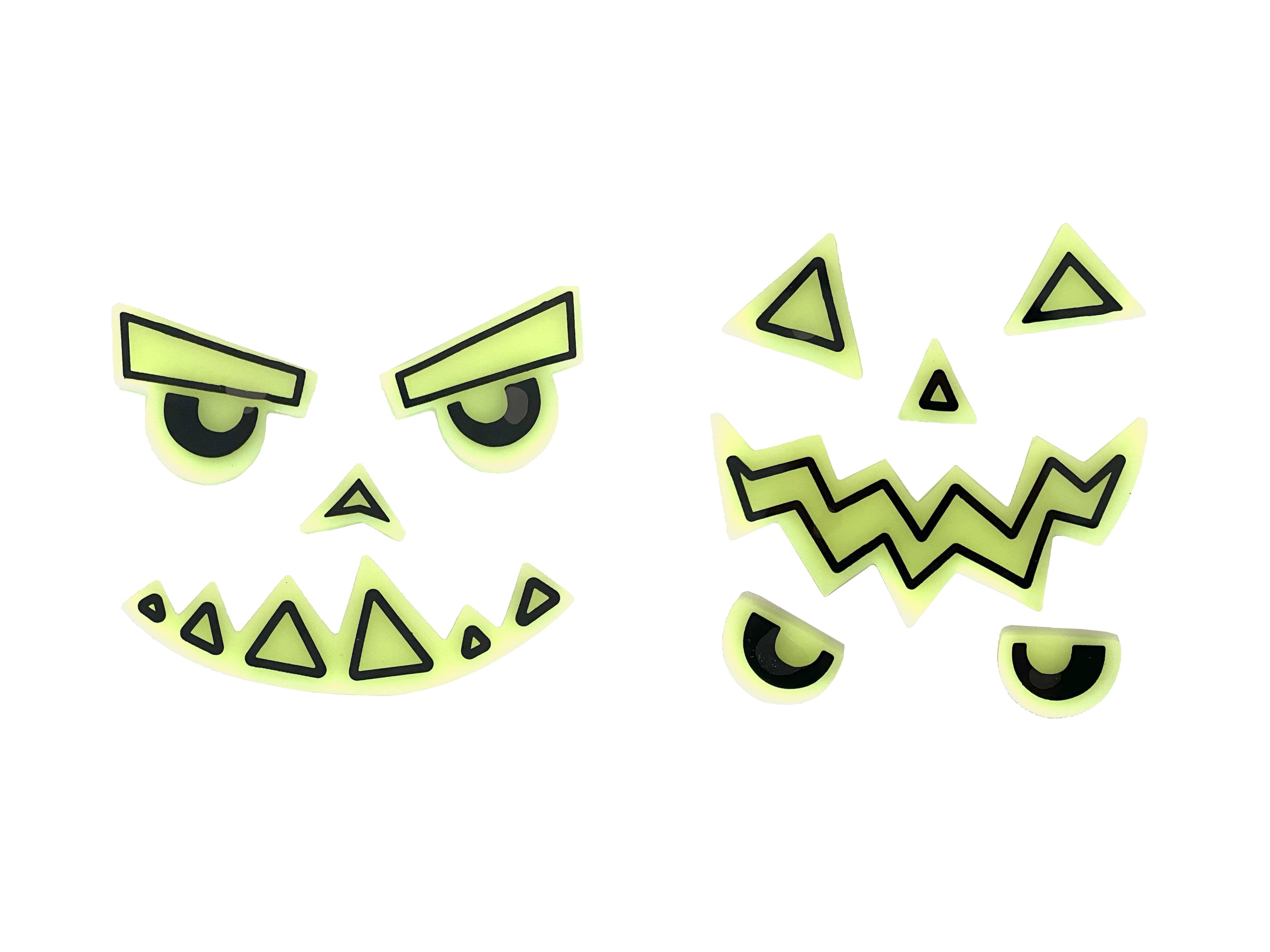 Glowing green face stickers with eyes, mouth, and triangles on a white background