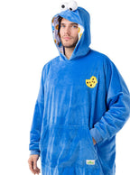 Mėlynas „Cookie Monster“ džemperis su gobtuvu, akimis ir sausainio emblema.